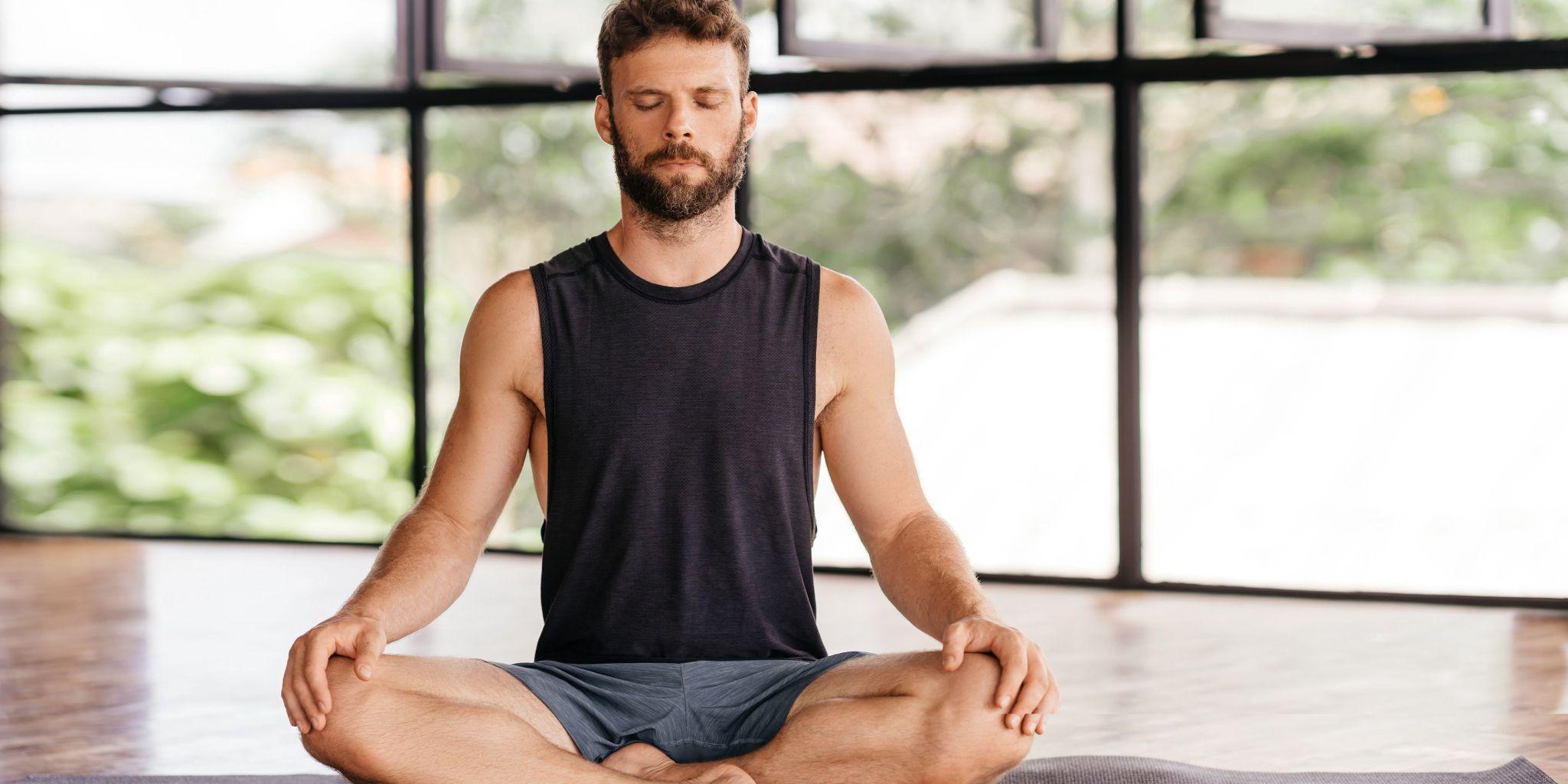 men doing yoga in sober living home